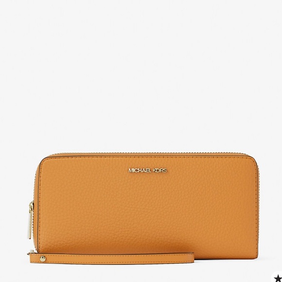 Michael Kors Handbags - MICHAEL KORS Jet Set Travel Lg Pebbled Leather Continental Wristlet
Rad Orange